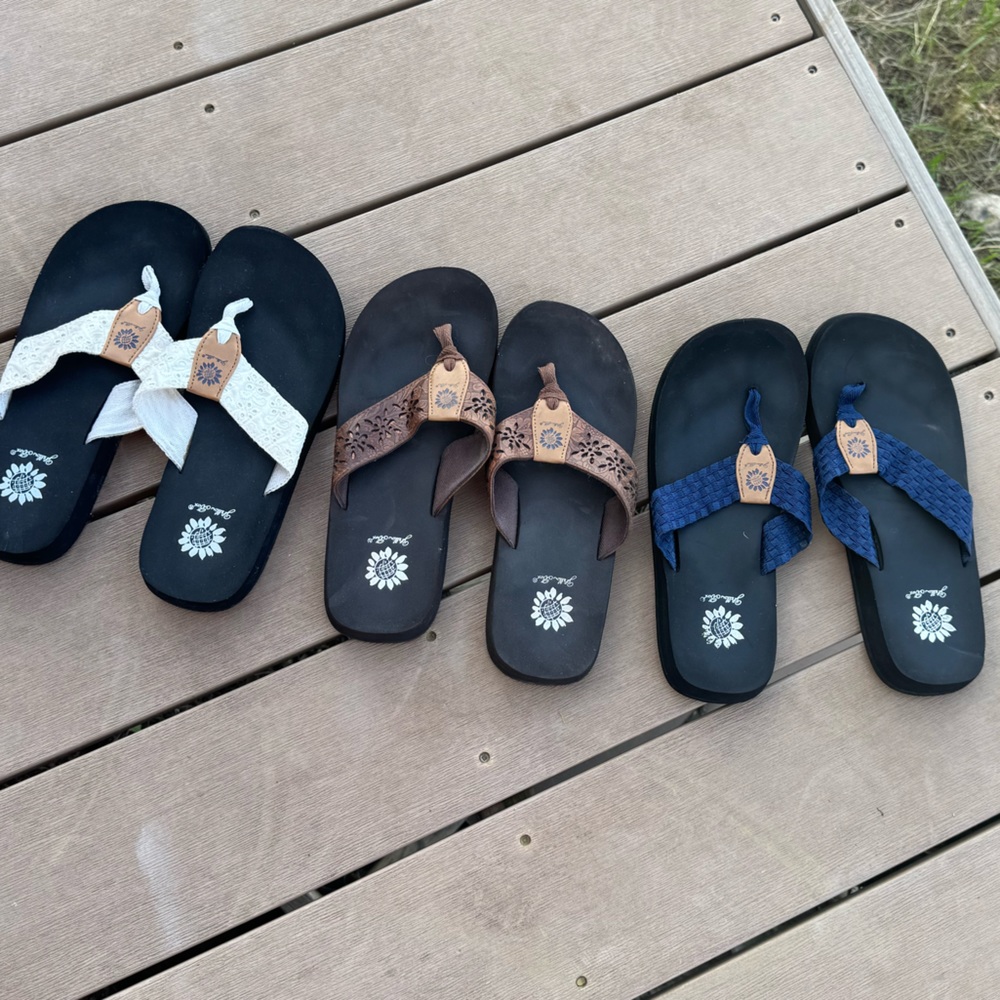Three pairs of yellow box flip flops